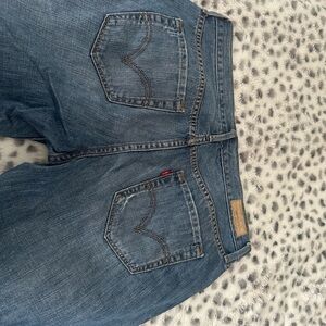 Levi's Boyfriend Blue Jeans with Classic Distressed Style